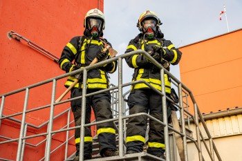 two-firemen-standing-on-stairs-3788978_(1).jpg